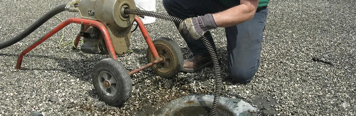 sewer rodding technician actively removing blockages from a sewer line in Spokane, WA